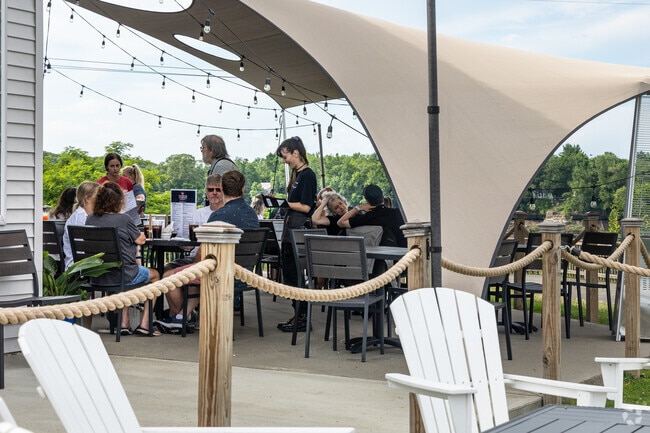 Enjoy a summer evening on the patio at Pepper's Landing near Milford.