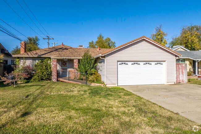 This home has a two-car garage and a brick face in Howe Edison.