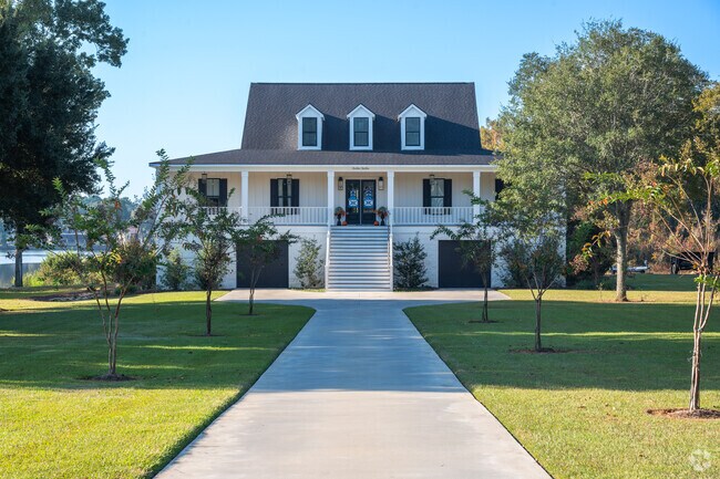 Newly-built homes in River Pointe Plantation have been raised to protect them from flooding.