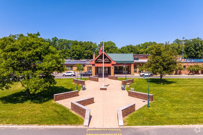 Students enter through the scenic front entrance of James Caldwell High School.