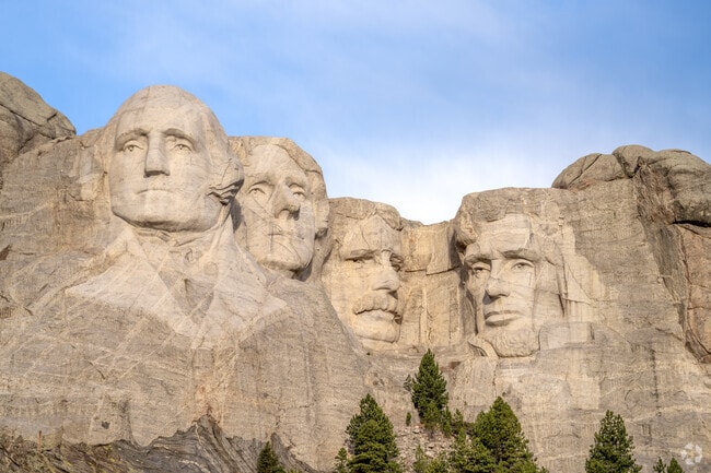 Presidential faces carved into Mount Rushmore draw millions of visitors annually.
