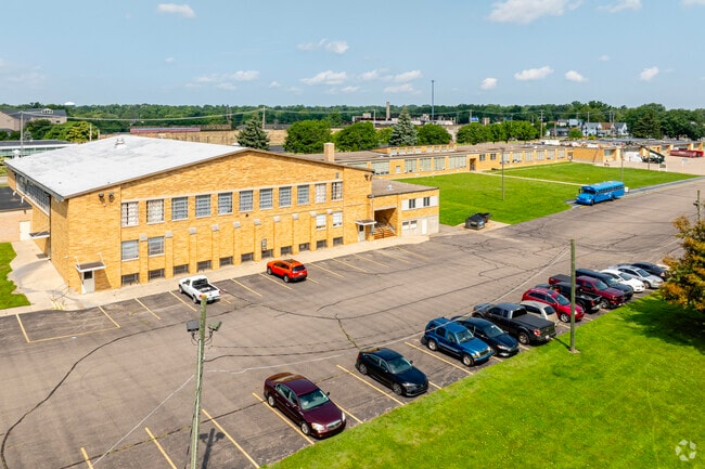 A lot behind St John Elementary Catholic School doubles as a pickup and drop-off drive.