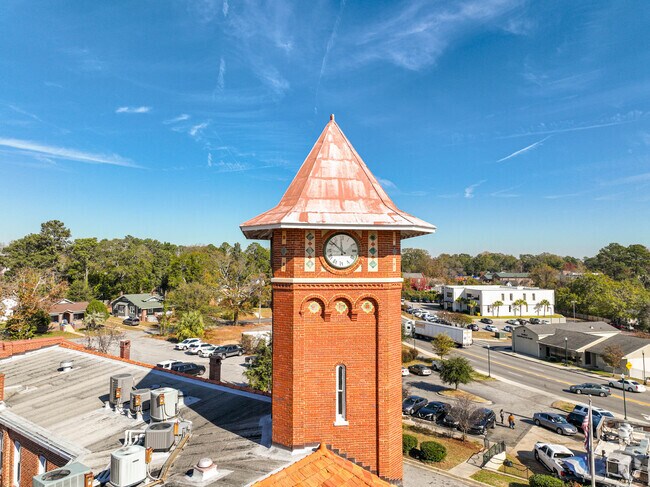 Downtown Denny Terrace includes the historic police building with a clock tower.