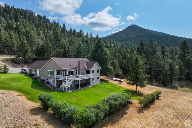 Montana City homes feature lush lawns and mountain backdrops, perfect for serene living.