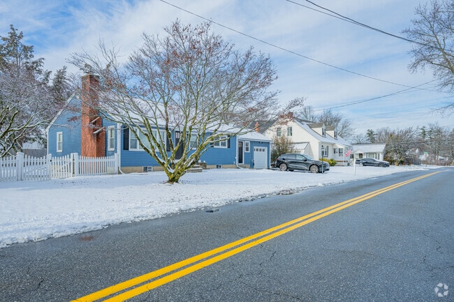 Single-level ranch homes with small front yards are common in Millville.