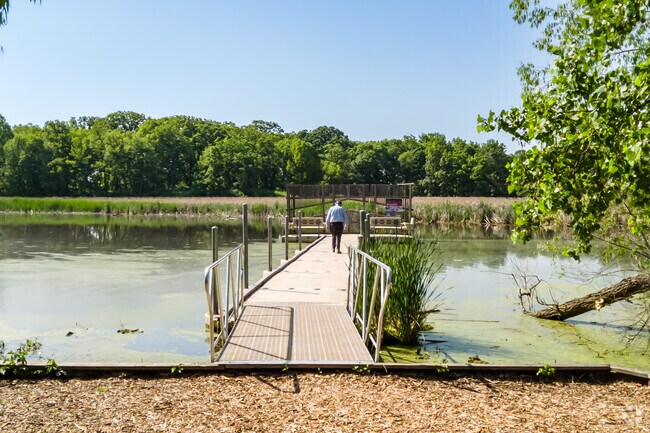 A resident of Northside-Wheaton, enjoys the fishing deck at Lincoln Marsh.