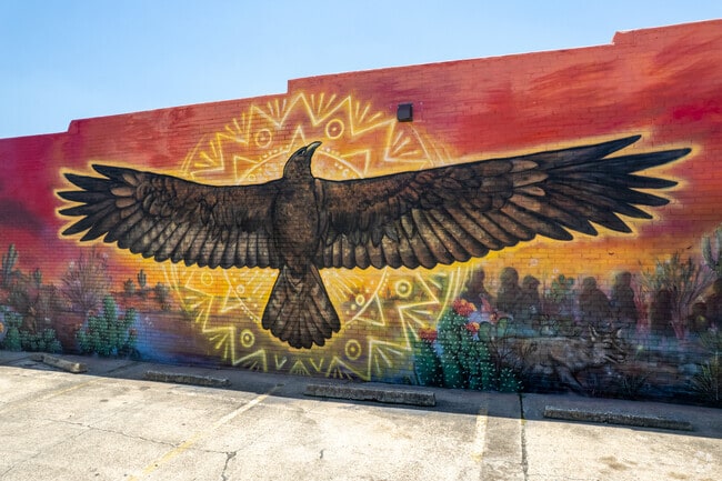 An eagle mural takes up a whole business wall in Levy.