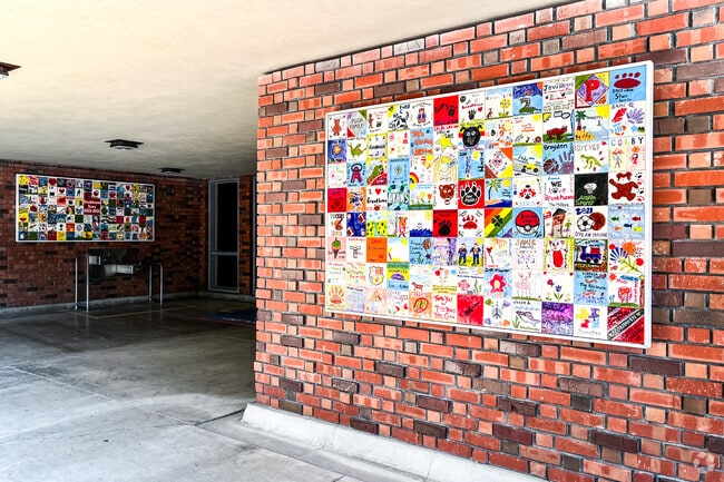 Brookhaven Bears show off their art at the tile mosaic on their campus walls.