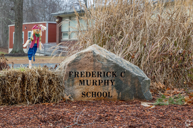 A beautiful stone sign greets you as you enter Frederick C Murphy in Weymouth.