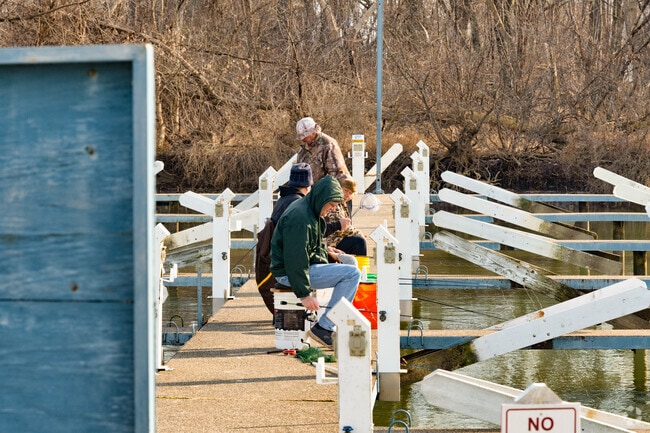 A group of friends enjoy an afternoon of fishing, in the marina of Lake Erie Metropark.