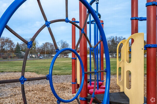 Manz Neighborhood Park has tons of cool climbing spots on its playground, perfect for some adventurous fun.