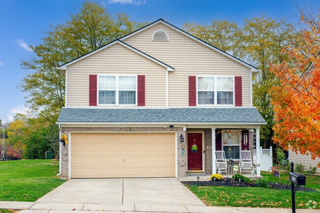 Front porch chairs adorn this lovely two-story home in Boone Creek East.