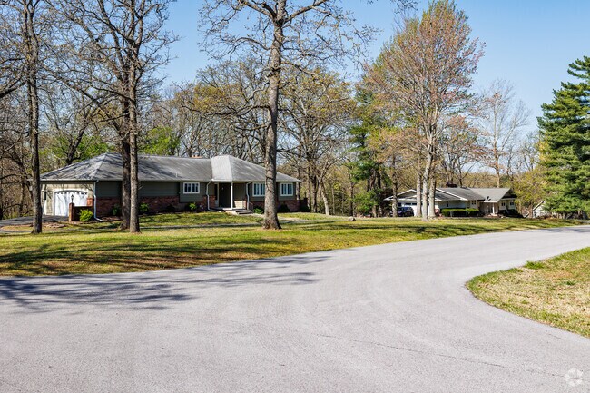 Homes in Silver Creek are surrounded by large mature trees.