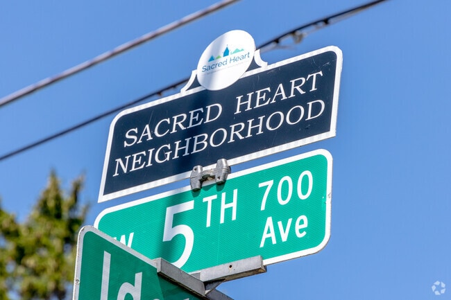 Street signs mark Sacred Heart’s quiet blocks just south of the Fox River.