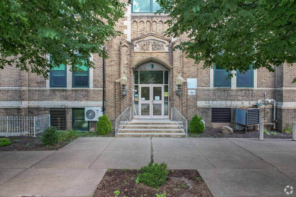 Entrance shows Elroy Avenue Elementary School and its old architecture.