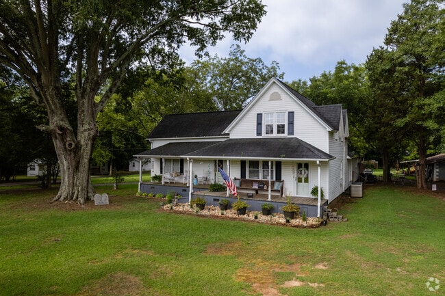 Some farmhouses sit in more wooded areas sounded by trees in Roebuck.