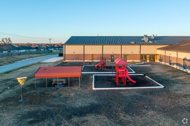 Children enjoy playing on the playground at Pea Ridge Primary School.
