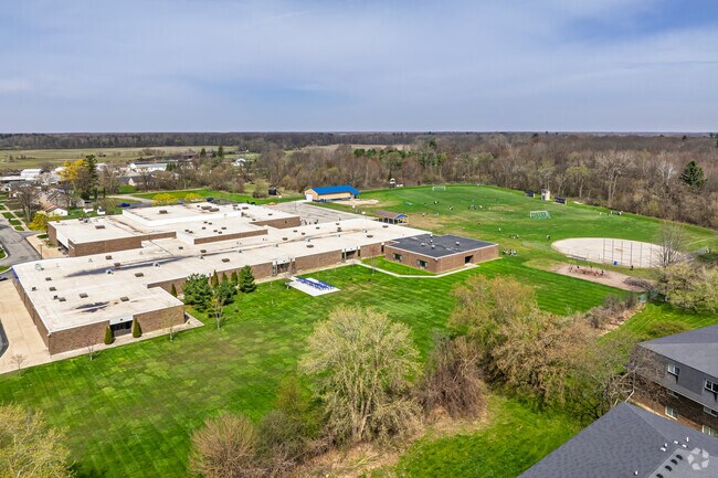 Marshall Greene Middle School features a large area behind the school for student athletics.