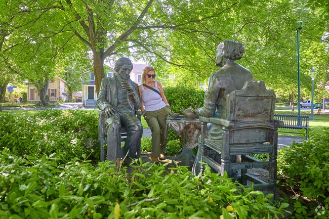 A Canadian tourist visits the Susan B. Anthony Square Park.