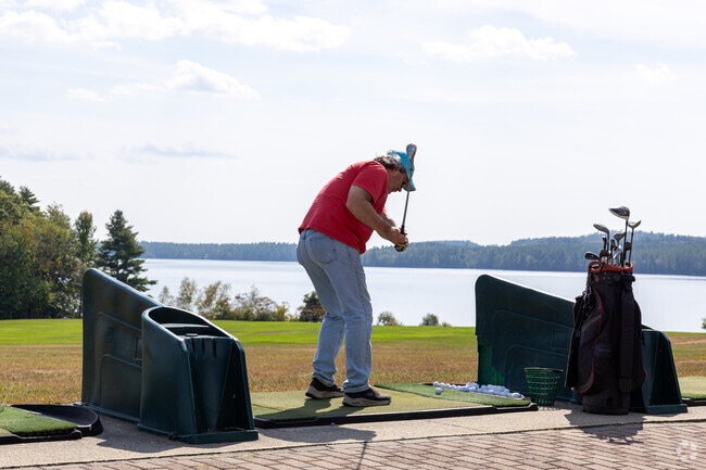 Practice your golf swing with a stunning view at Taber's on the Lake in Auburn.