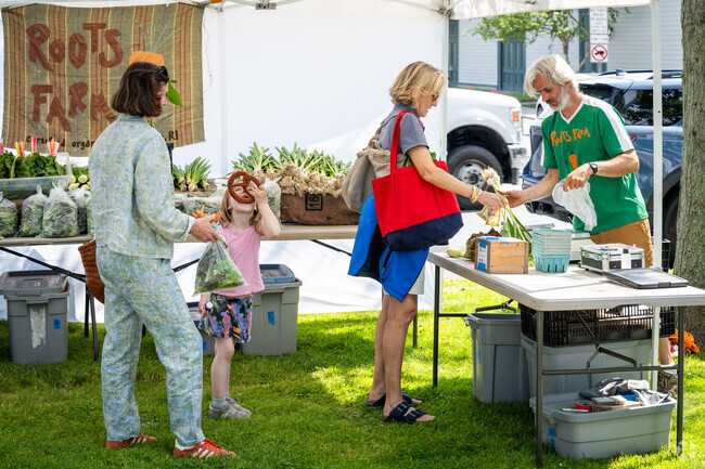 Locals stop by Newport’s Aquidneck Growers Market, where freshness meets community.