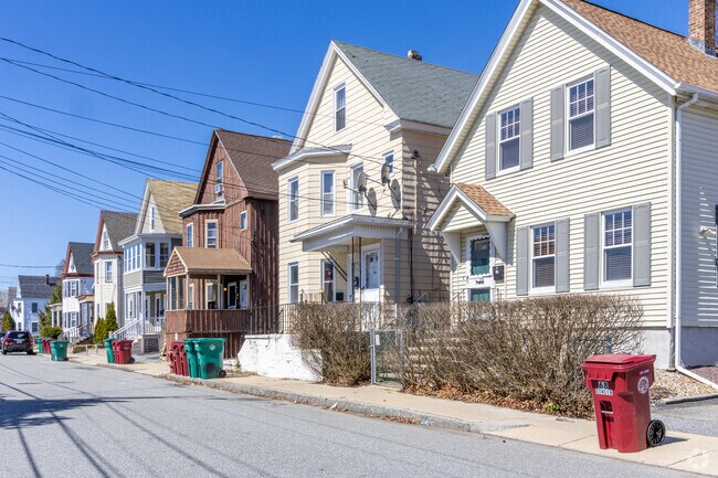 A row of both single and multi-family homes line the streets of the Sacred Heart neighborhood of Lowell, MA.