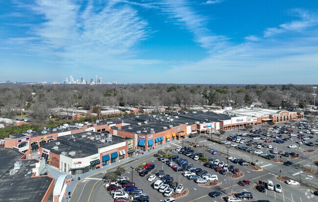 An aerial view of Cotswold Village in Sherwood Forest, the Charlotte skyline in the distance.