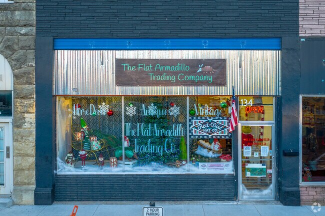The American flag proudly waves in front of The Flat Armadillo Trading Co. near Willow View.