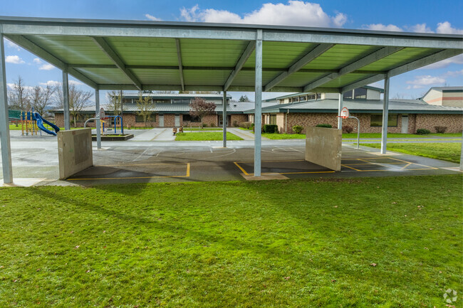 Prairie Mountain School has a covered area for students to play under in Eugene.