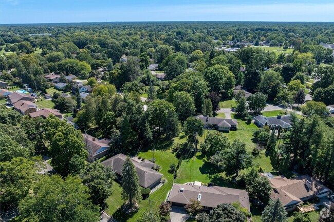 Moores River Drive is an affluent area of Lansing, with large houses and lots.