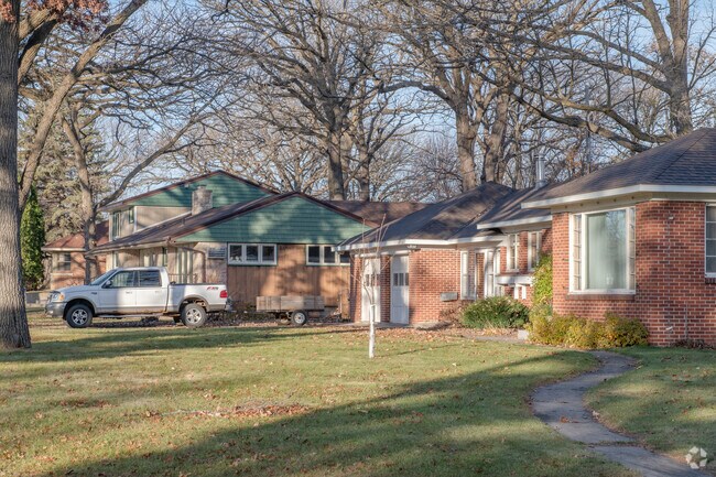 A row of modern homes in Colonial Gardens includes ranch and colonial styles.