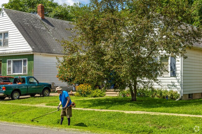 Residents in Pillsbury can be seen taking care of their front yards.