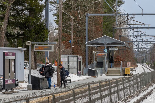 Commuters wait for the MBTA train to Boston at the Sharon MBTA station.