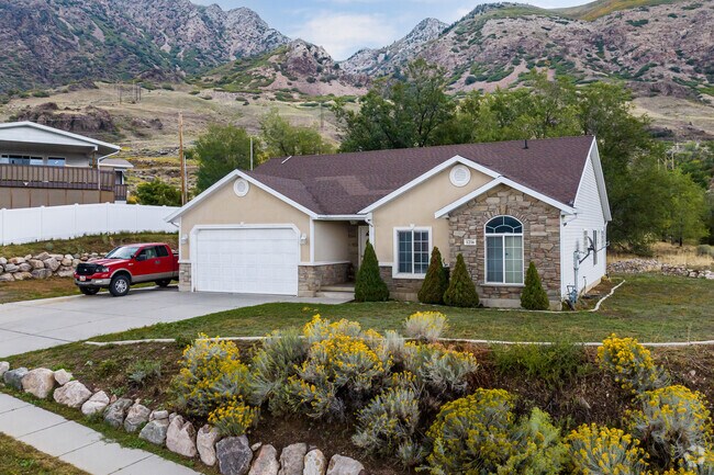 This home has stone details incorporated in the landscape and the house itself.