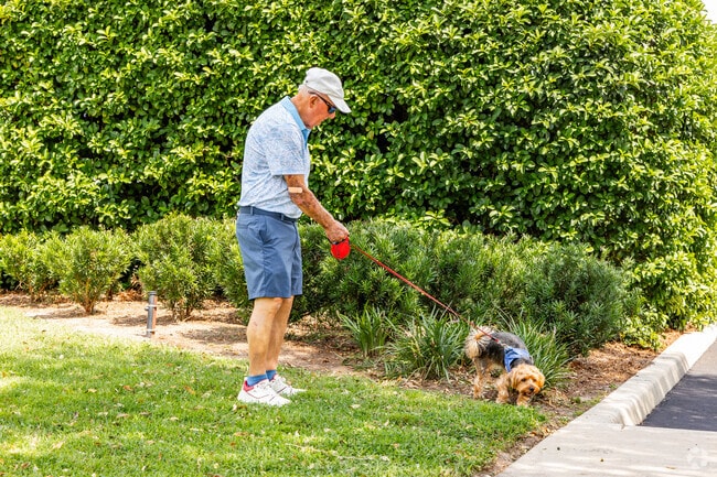 Residents of the Village of Duval often walk their dogs through the neighborhood.