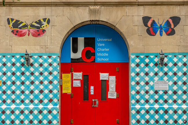Butterfly murals are scattered along the walls of Universal Vare Charter School.