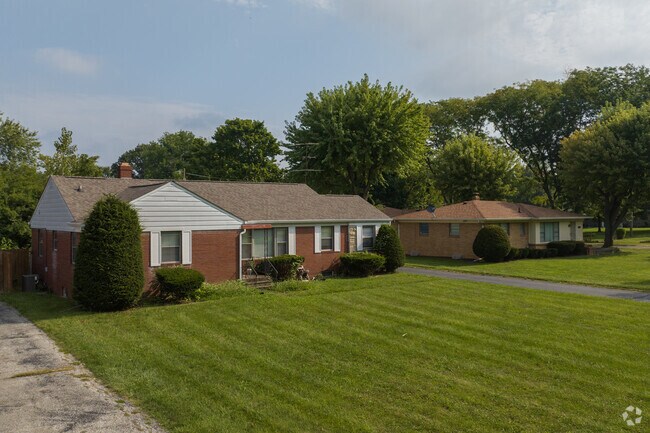 A row of modest brick single story homes found in northern East Gate.