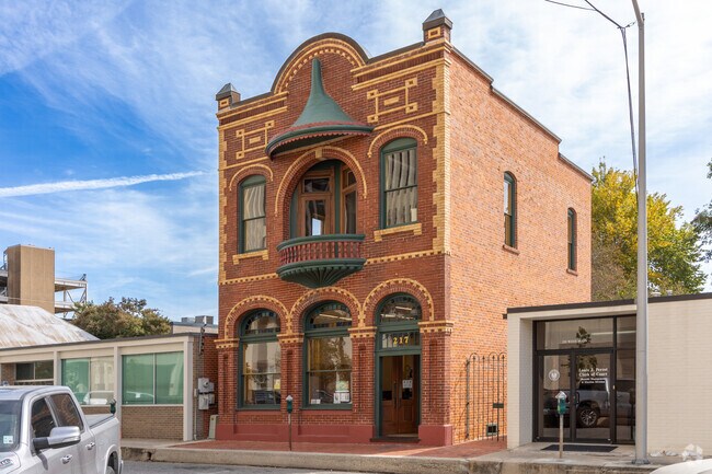 Red brick Creole-style buildings are common in Lafayette’s West End.