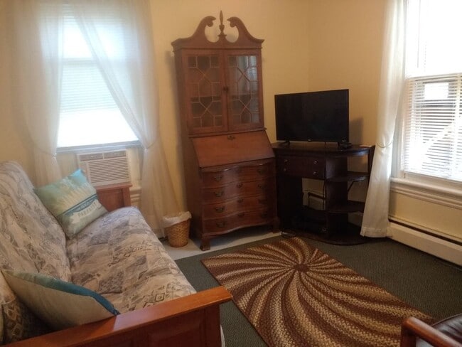 living room with secretary desk