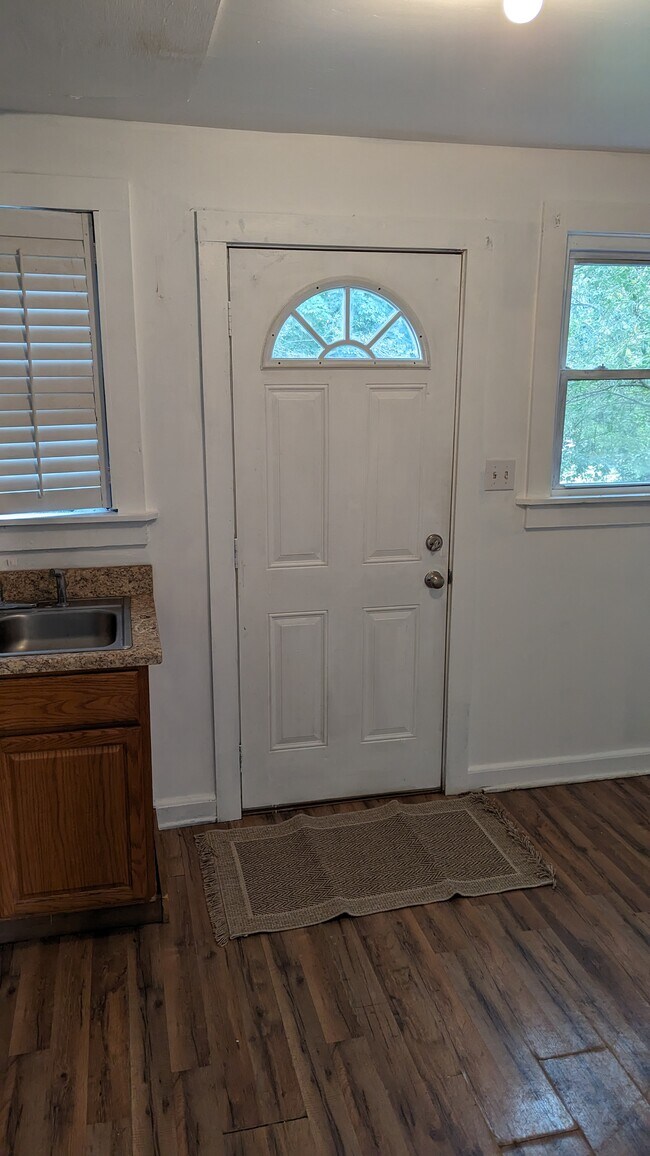 Door in kitchen leading to back porch