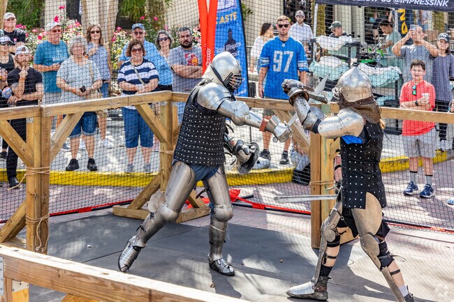 People watch an armed combat performances at the Faded Kingdom Beer Fest in Baldwin Park.