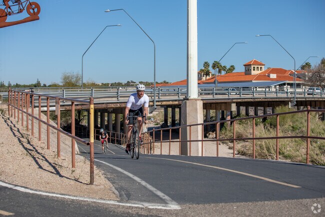 Bicyclists Utilize The Loop At Rillito River Park Daily To Get Across The City