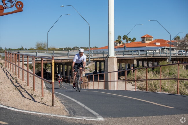 Bicyclists Utilize The Loop At Rillito River Park Daily To Get Across The City