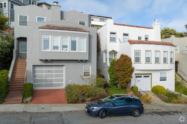 Mediterranean-style homes with tile roofs line the steep streets of Mount Davidson Manor.