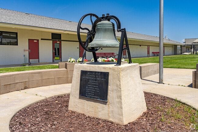 An old school bell is a highlight at the entrance to Tipton Elementary School.