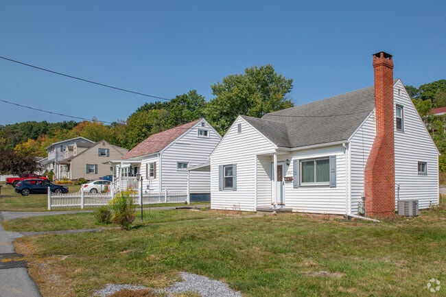 A row of Cape Cod style homes graces a street in the Wehnwood neighborhood.