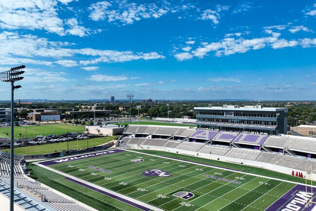 ACU stadium highlights both the cityscape and the excitement on the field.