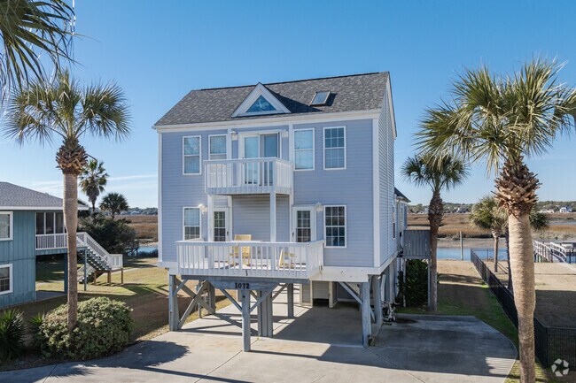 Murrells Inlet has elevated four-square style homes with scenic marsh views.