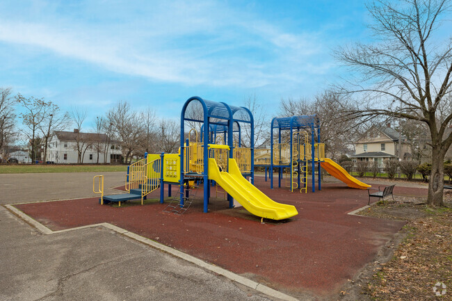 Benjamin Franklin outdoor playground beckons with colorful equipment.