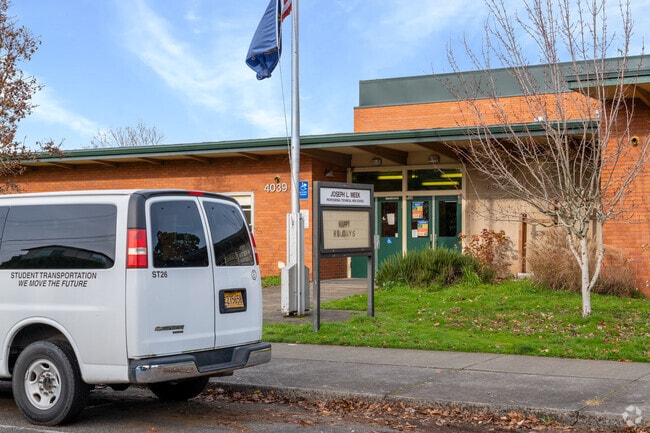 The school shuttle and signage welcomes you as you enter.